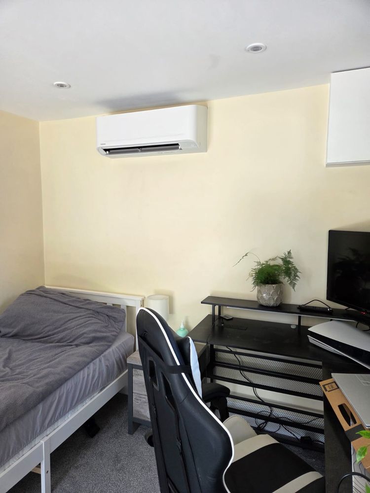 Indoor unit in a bedroom used as a study