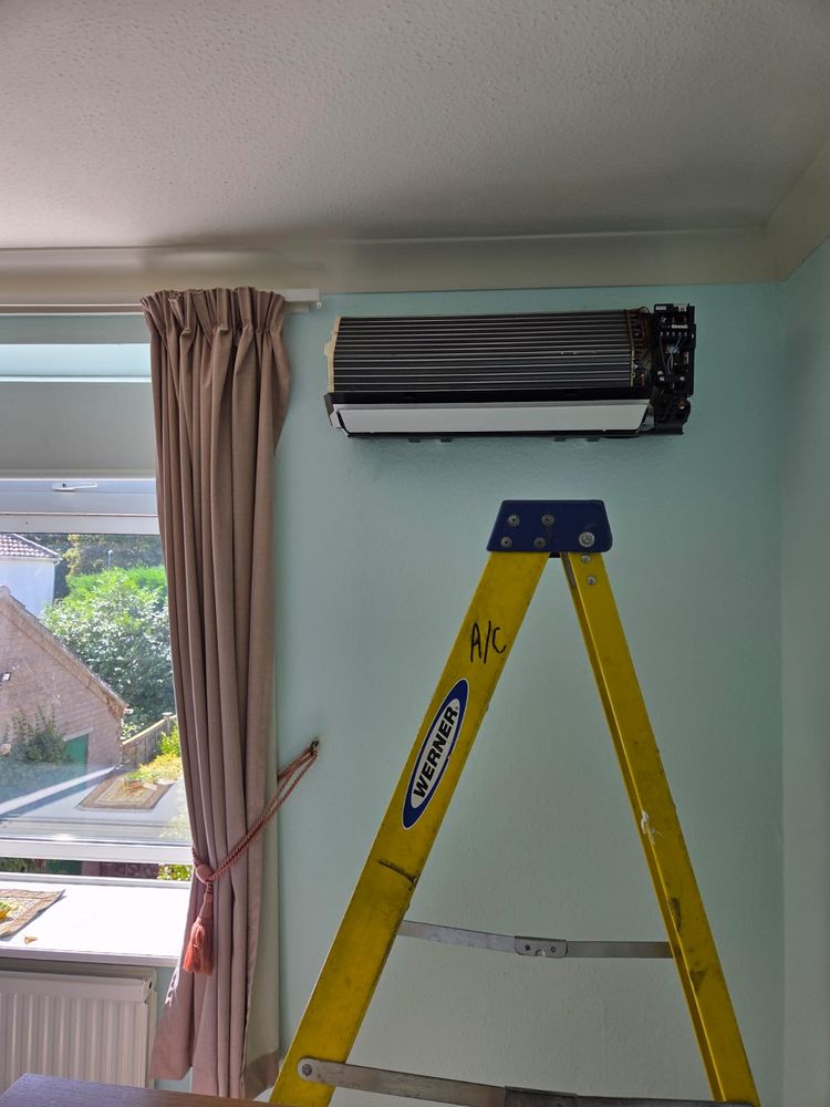Indoor unit being fitted, cover off and brackets set