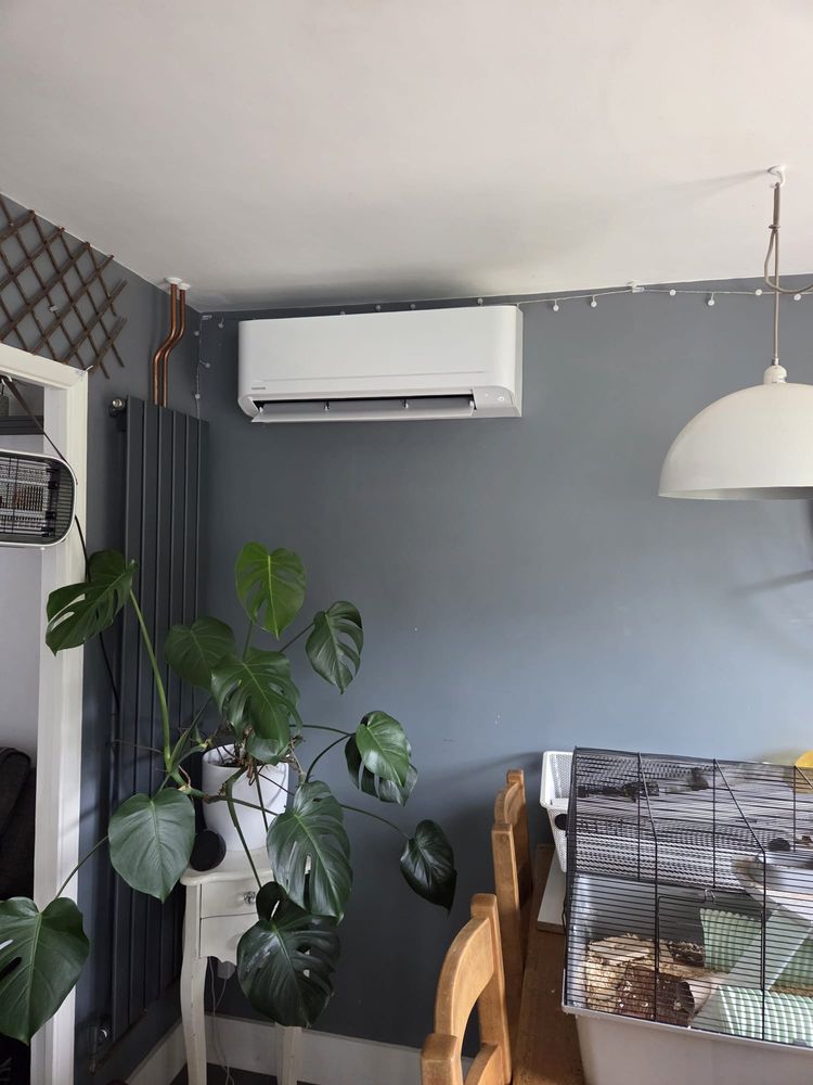 Indoor unit in a living room, sited clear of the window