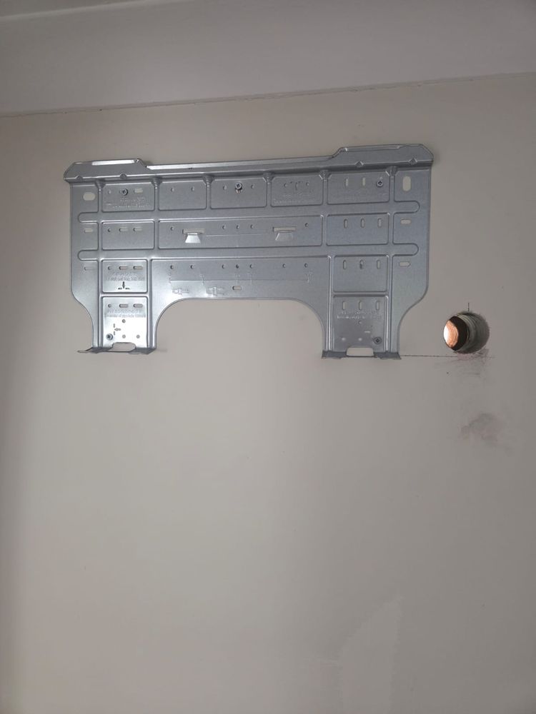 Mounting plate set level with the core hole cut beside it