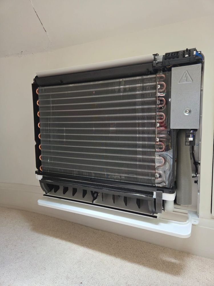 Indoor coil exposed for cleaning during an annual service